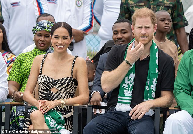 Prince Harry and his wife Meghan at an exhibition sitting volleyball match today in Abuja, Nigeria