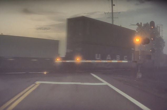 Craig Doty II reported that he had owned his Tesla vehicle for less than a year, but that the full self-driving feature had already caused nearly two accidents. In the image: The Tesla approaches the train but does not slow down or stop.