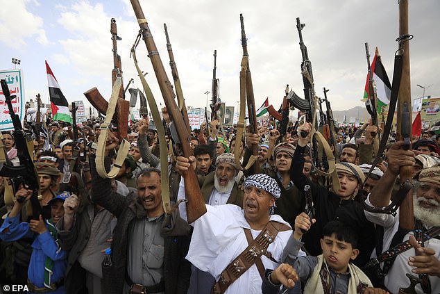 Houthi supporters raise their weapons during a protest in solidarity with the Palestinian people, in Sanaa, Yemen, on May 24, 2024.