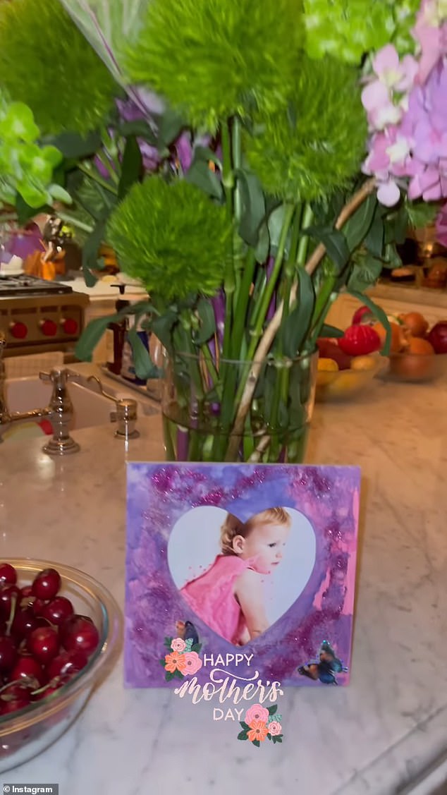 Rebel Wilson showed off a bouquet of flowers she had been given, along with a heart-shaped frame featuring her baby daughter, Royce.