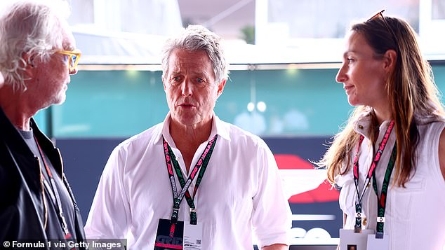 The Hollywood couple were seen chatting with others as they watched the circuit just before the Emilia-Romagna race at the Autodromo Enzo e Dino Ferrari circuit.