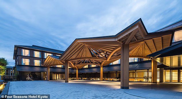 The entrance to the Four Seasons Hotel Kyoto is shaded by a striking wooden canopy.