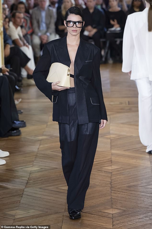 The 28-year-old supermodel wore dramatic square glasses, slicked-back hair and a black suit designed by the former Spice Girl at her Spring/Summer 2024 show last year.