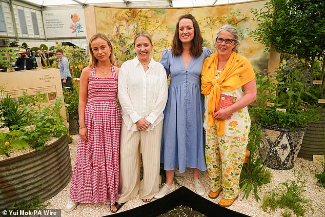 Garden designers Lady Amelia Windsor, Tabi Jackson and Charlotte Denne and author Victoria Bennett in the Kent Wildflower Seeds garden, during the RHS Chelsea Flower Show