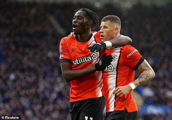 Soccer Football - FA Cup - Fourth Round - Everton v Luton Town - Goodison Park, Liverpool, Britain - January 27, 2024 Luton Town's Elijah Adebayo and Ross Barkley celebrate after Reece Burke scores their first goal REUTERS/Carl Recine