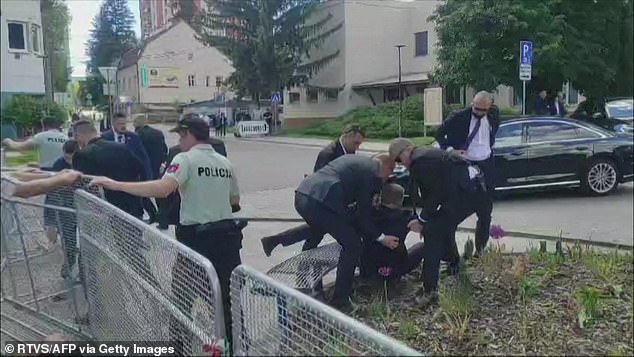 Staff carrying Slovakia's Prime Minister Robert Fico (C) to a vehicle after he was shot in Handlova on May 15.