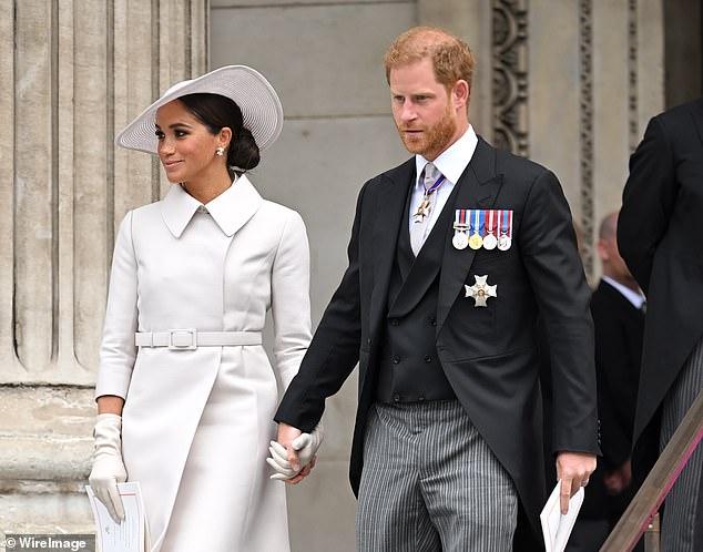 Meghan Markle and Prince Harry booed during the late Queen's Platinum Jubilee celebrations in 2022 (couple photographed at event)