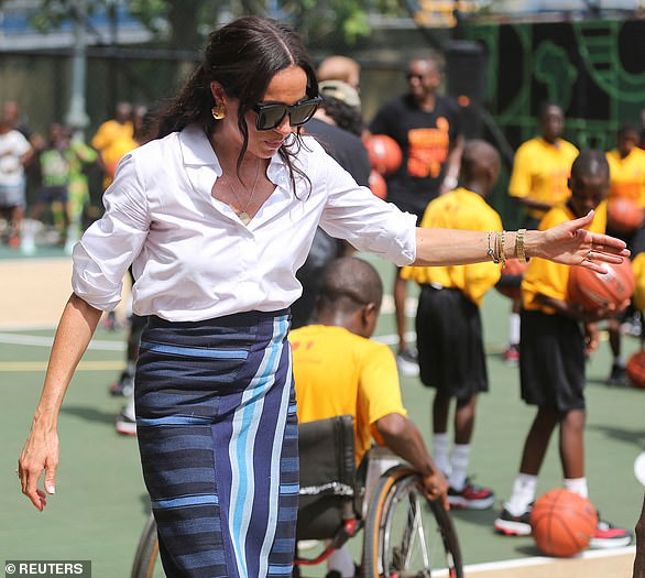 Meghan appeared to be wearing a suit made from Aso Oke, a handwoven fabric from southwestern Nigeria, which she had been given as a gift at the beginning of the trip.