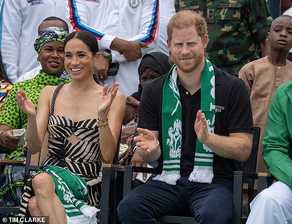 Meghan is feted by Sussex Squad superfans then shares a