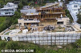 Now, the foundations of J Group Projects' massive building, which is four times the size of the houses on either side, have begun to take shape.