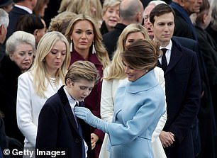 Melania Trump is known to be a protective mother of her son Barron, who was 10 years old when his father became president; above she fixes his tie on inauguration day