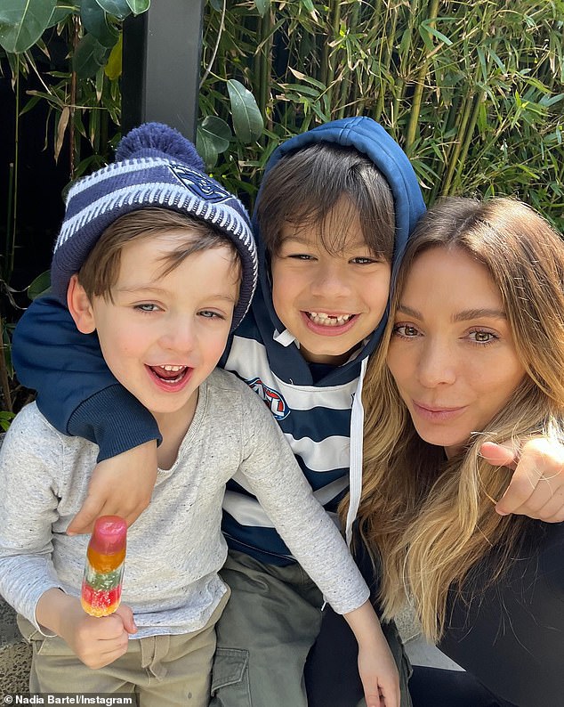 The 38-year-old shares her children Aston, eight, and Henley, six, with her ex-AFL star husband Jimmy Bartel, to whom she was married from 2014 to 2021. Pictured with her children