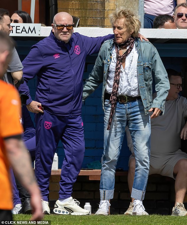 Newly bald Ray Winstone (left) joined Rod Stewart (right) and stylish Penny Lancaster at a charity football event on Sunday.