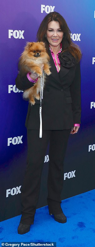 Lisa brought one of her beloved dogs to the red carpet