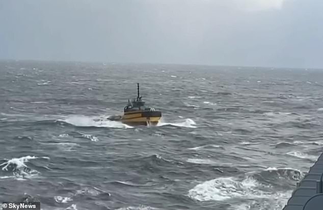 A ship seen from the Pacific Adventure during the search for a missing passenger