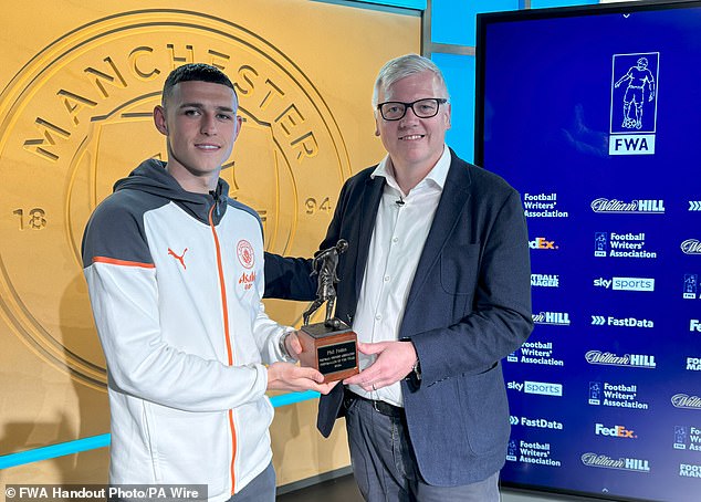 Phil Foden received his FWA Footballer of the Year award from President John Cross.