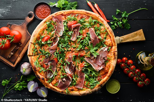A new book by a food historian has revealed that the countries of origin of many famous national dishes are not what one might think.  Pictured: Stock image of a pizza topped with prosciutto and arugula.