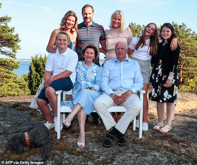 Official photograph of the royal family celebrating the 45th birthday of Crown Prince Haakon (above 2nd left) with his family, while posing with Princess Martha Louise (above left), Crown Princess Mette-Marit (above C) , Princess Ingrid Alexandra (2nd right) and Maud. Angelica Behn (right), (bottom left) Prince Sverre Magnus, Queen Sonja and King Harald V, in July 2018