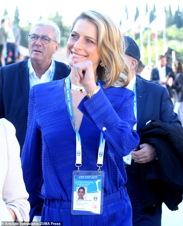 She looked in high spirits while attending the event in Athens today amid their separation announcement.