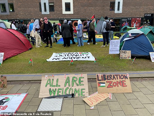 People gather during a protest in support of the Palestinians, during the ongoing conflict between Israel and the Palestinian Islamist group Hamas, at Newcastle University in Newcastle on May 1.