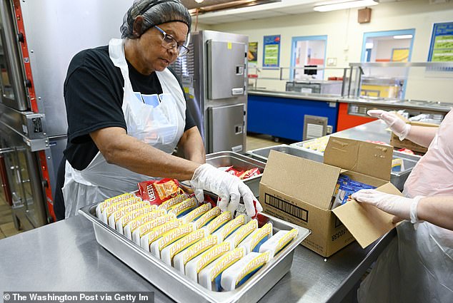 A cafeteria worker prepares lunchables for lunch at a school in Pembroke, North Carolina.