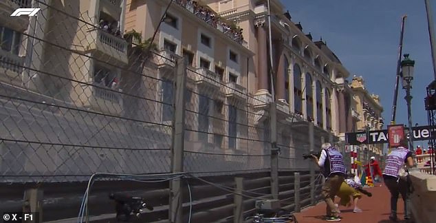 An extraordinary new angle showed photographers on the track taking cover as Perez crashed.