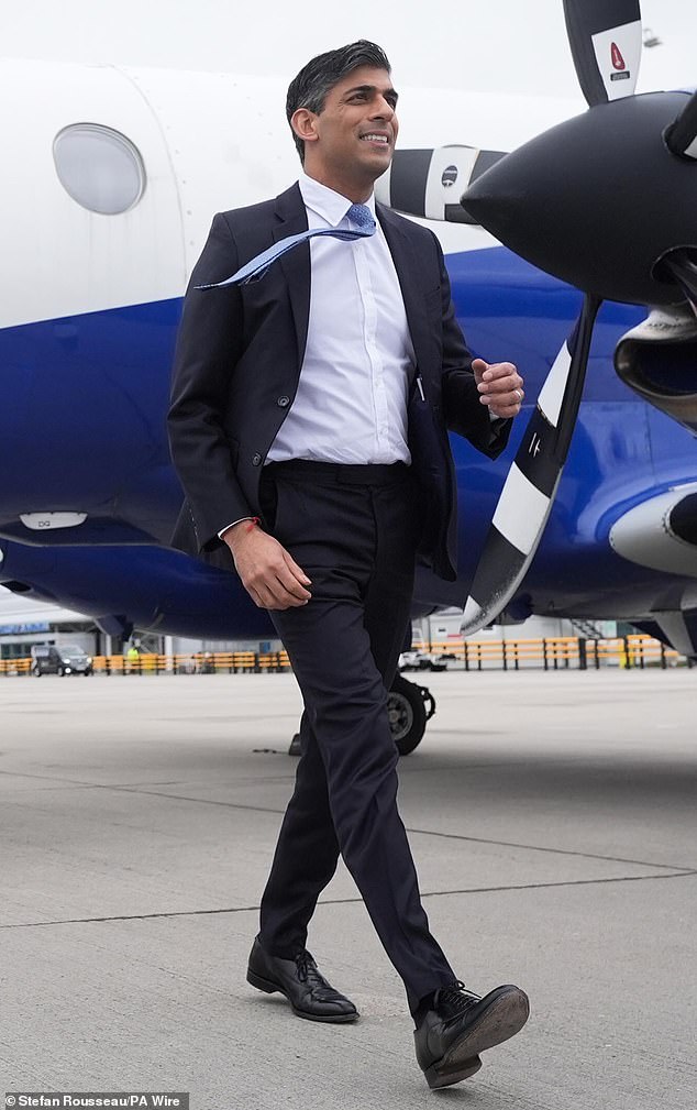 Prime Minister Rishi Sunak arrives at Inverness airport, Scotland, while on the general election campaign on Thursday.