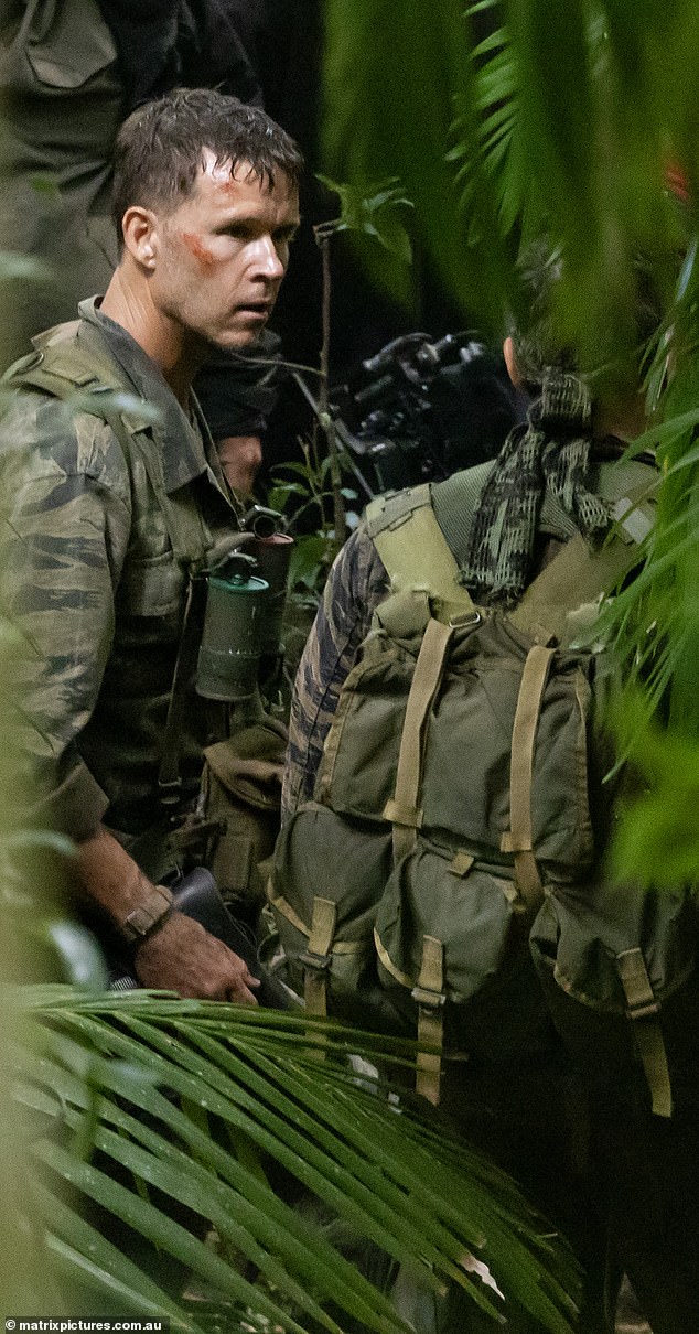 The former Home and Away hunk looked almost unrecognizable in the shots, wearing a military camouflage suit and matching boots.