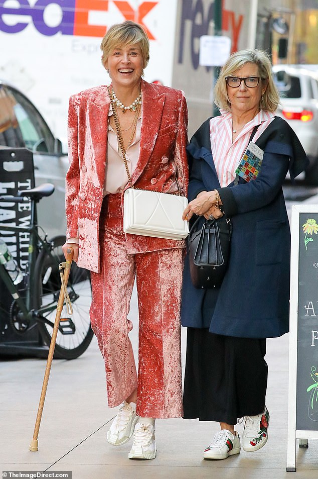 The Basic Instinct star, 66, paired the colorful outfit with a pair of white sneakers and a white crossbody bag.