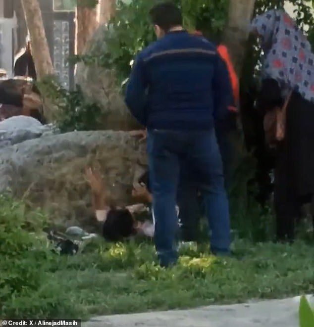 Footage of the incident was captured in what appears to be a busy public park in Iran (reportedly Borujerd) and shared on social media. The teenager was pushed to the ground by the suspicious moral police officer. His fate was unclear from the images.