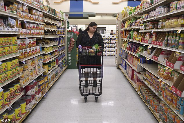 Preschool teacher Jaqueline Benitez, one of the 42 million food stamp recipients in the U.S., shops for groceries at a supermarket in Bellflower, California.