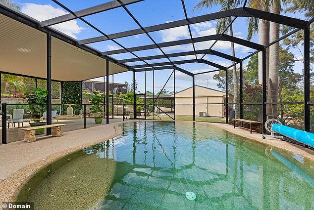 The luxurious estate also features a stunning covered outdoor pool (pictured)