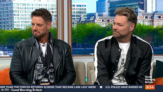 The journalist, 53, was chatting to Boyzone's Keith Duffy (left) and Westlife's Brian McFadden (right) alongside her co-host Richard Madeley.