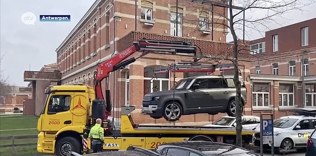 Authorities tow the Land Rover supposedly belonging to Bril for examination.