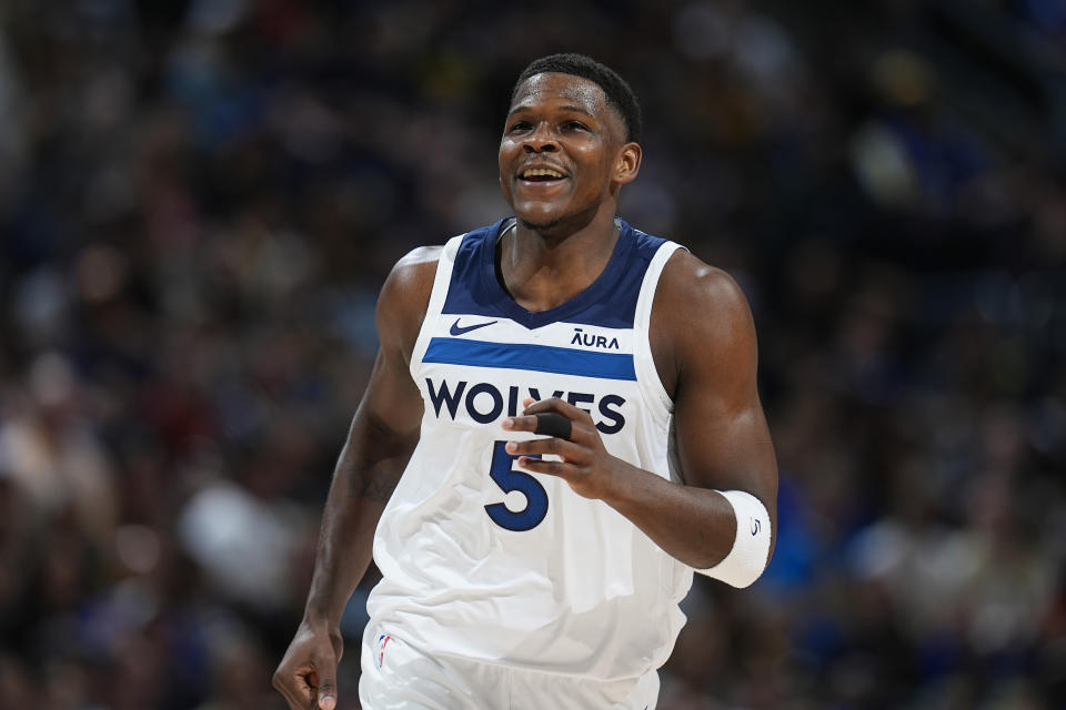 Minnesota Timberwolves guard Anthony Edwards reacts after scoring a basket in the first half of Game 1 of an NBA basketball second-round playoff series against the Denver Nuggets, Saturday, May 4, 2024, in Denver.  (AP Photo/David Zalubowski)