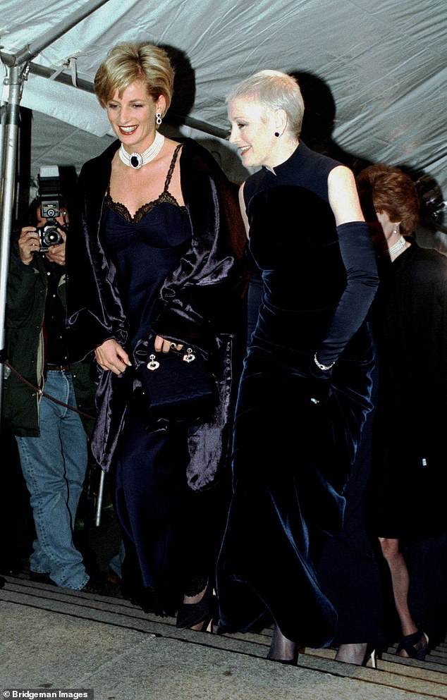 Diana's £10,000 midnight blue dress, trimmed in black lace and worn under a matching velvet coat, was the sensation of the night. Here she is pictured with magazine editor Liz Tilberis.