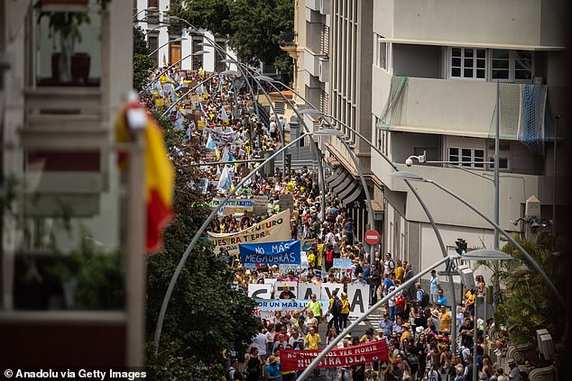 Protesters flooded the streets of Tenerife last month (pictured), calling on local authorities to temporarily limit the number of visitors to ease pressure on the islands' environment, infrastructure and housing stock, and put brake on property purchases by foreigners.