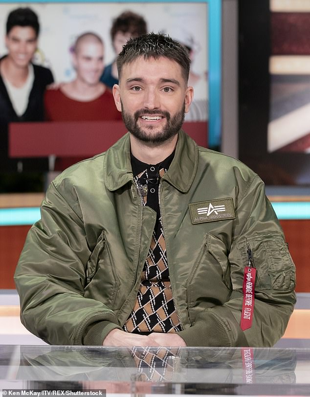 The Wanted's Tom Parker died in 2022 after being diagnosed with glioblastoma.  Pictured: Tom Parker on the Good Morning Britain Christmas special in December 2021