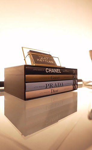 The video shows several expensive items in the showroom, including these designer bookcases.