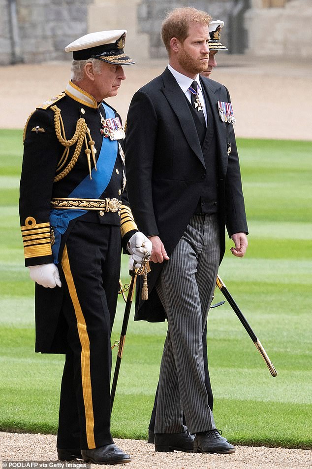 King Charles' moment caught attention yesterday after he dealt Prince Harry two punches in a matter of hours.  Pictured: Prince Harry and King Charles before the Queen's funeral in September 2022