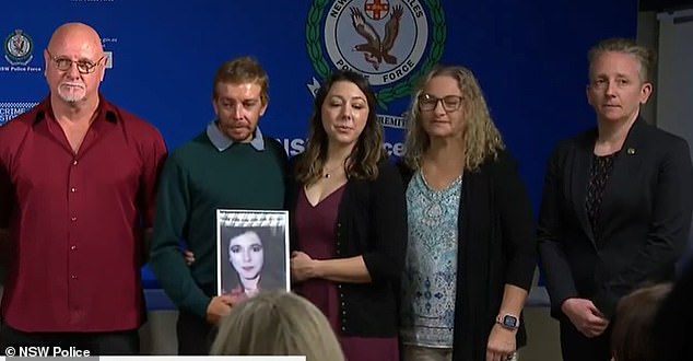 Ms Tiki's family (pictured centre) pleaded with anyone with information about her death to come forward and help police with their inquiries.