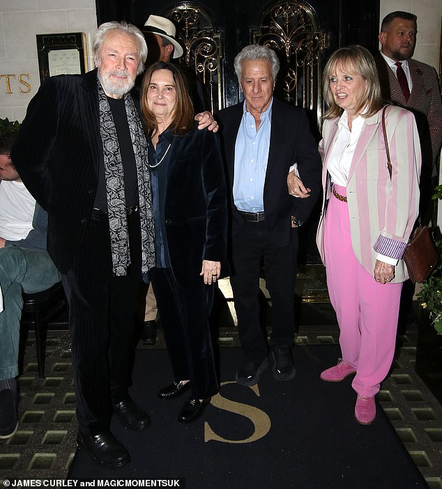 Twiggy, Leigh, 78, Dustin and Lisa, 69, looked friendly as they walked arm in arm as they left the luxury London restaurant.