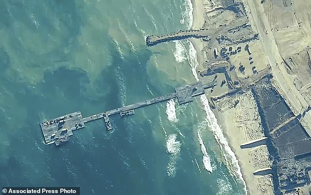 Repairs to the US-built floating dock could take more than a week, and humanitarian aid deliveries to Gaza through the dock have been halted. The pier is pictured on May 16.