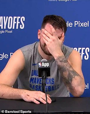 Doncic put his hand to his face