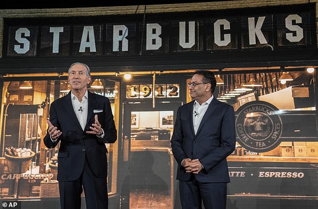 Howard Schultz, left, speaks while still interim CEO of Starbucks after introducing incoming CEO Laxman Narasimhan during a 2022 investor day in Seattle.