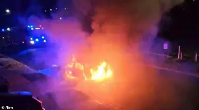 The car burst into a fireball after burning down on a quiet suburban street.