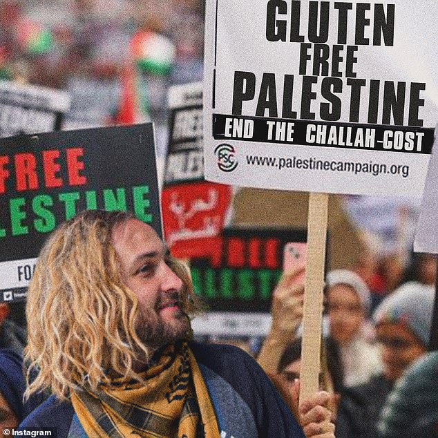 A photo of LE Staiman protesting 'Gluten-free Palestine: ending the cost of challah'