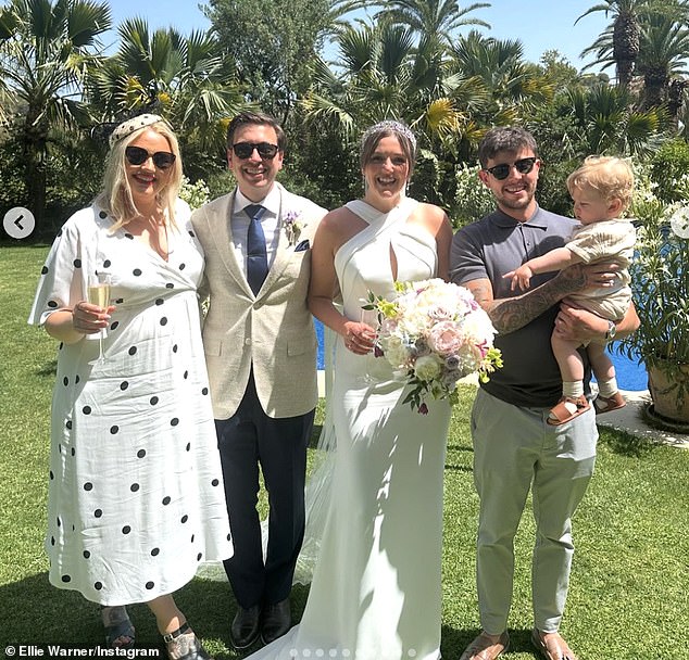 Ellie looked stunning in a long white dress with black pois and a matching bridal hat, as she sported a pair of stylish black sunglasses and posed with Nat, little Ezra and the newlywed couple.