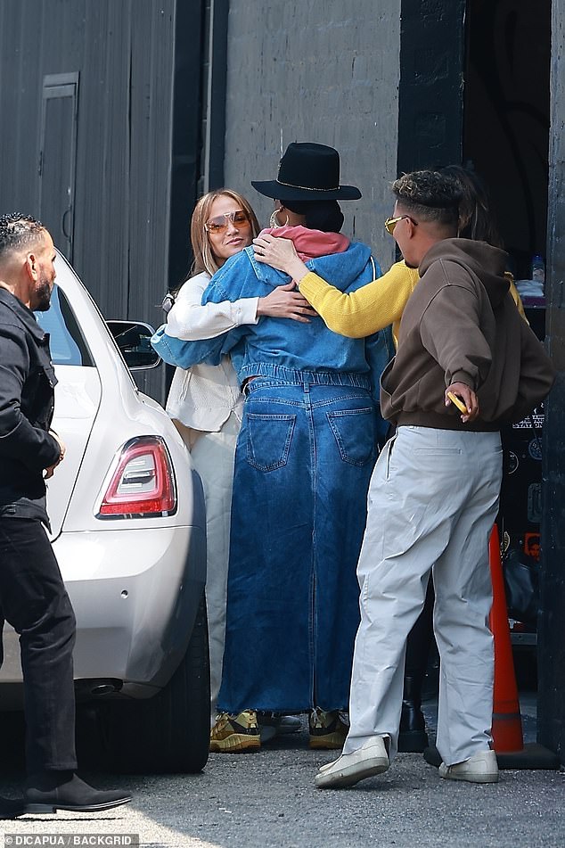 After sliding out of the passenger side of a white car, the two-time Grammy nominee exchanged friendly hugs with several members of her team.