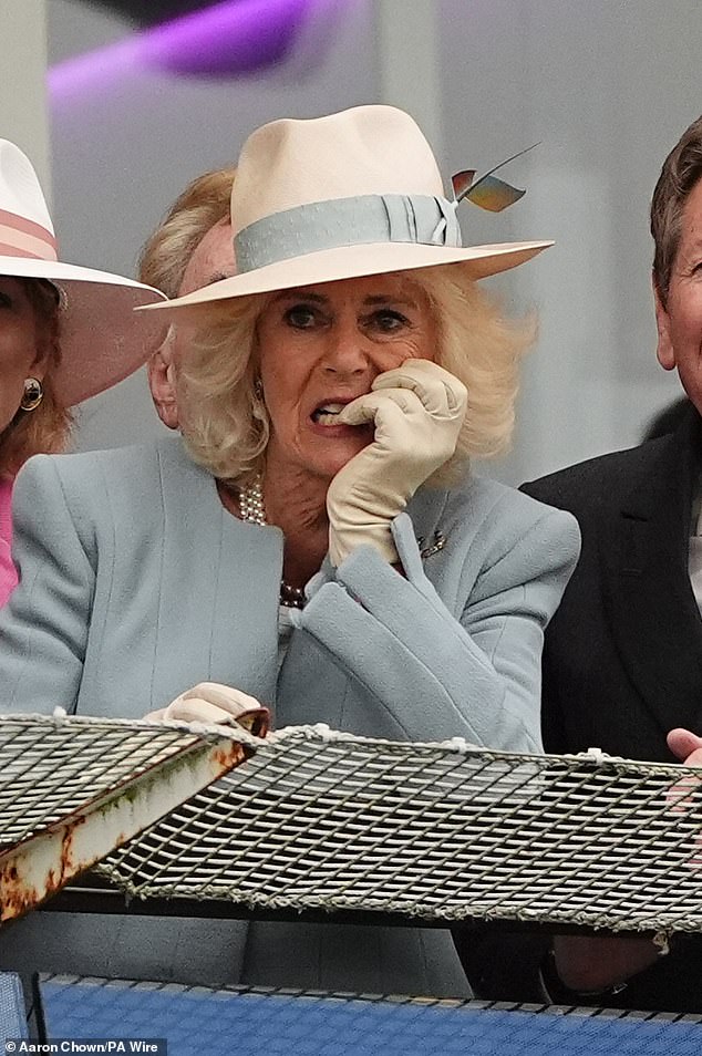 Queen Camilla was pictured looking tense as she watched the Treasury race today.